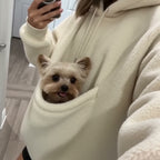 Full outfit in the mirror, cream hoodie with the pouch