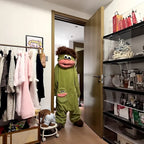 Monster onesie in the closet doorway, maker's photo